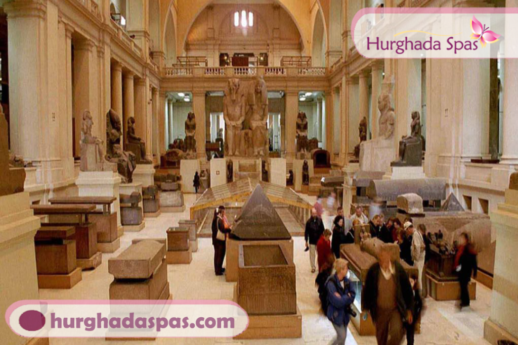 Tourists exploring the Grand Egyptian Museum galleries near Cairo, Egypt
