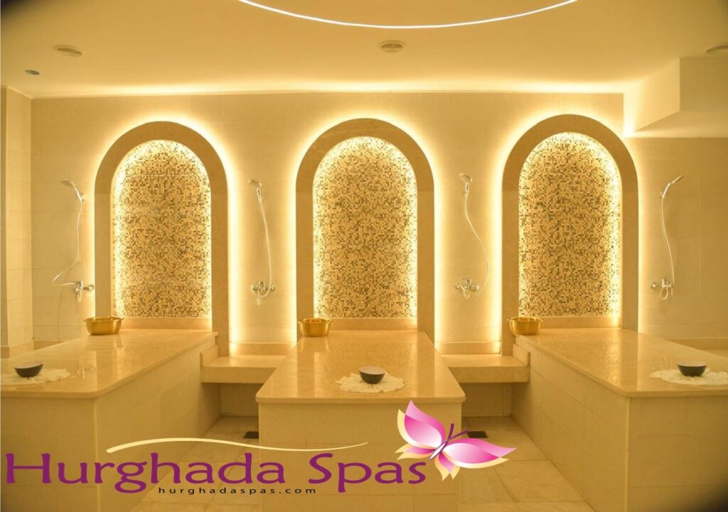 Luxurious Turkish Hamam interior at Soul Spa Hurghada with heated marble tables and golden arched alcoves.
